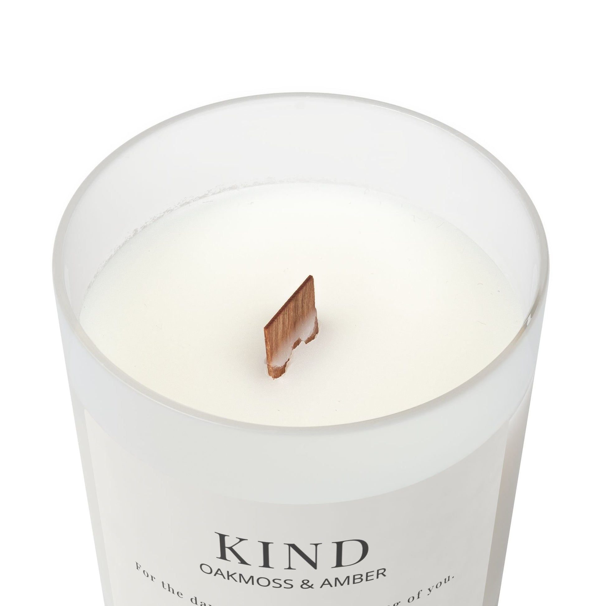 Top of KIND oakmoss and amber candle in frosted glass jar with wooden wick