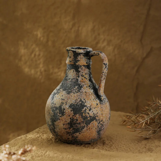 Vintage-style ceramic jug vase with weathered black and beige finish