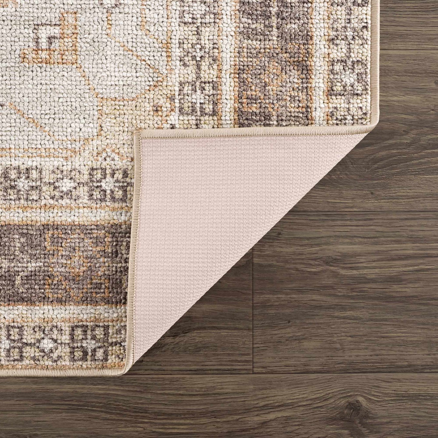 Close-up of washable rug showing woven polyester texture and non-slip rubber backing.