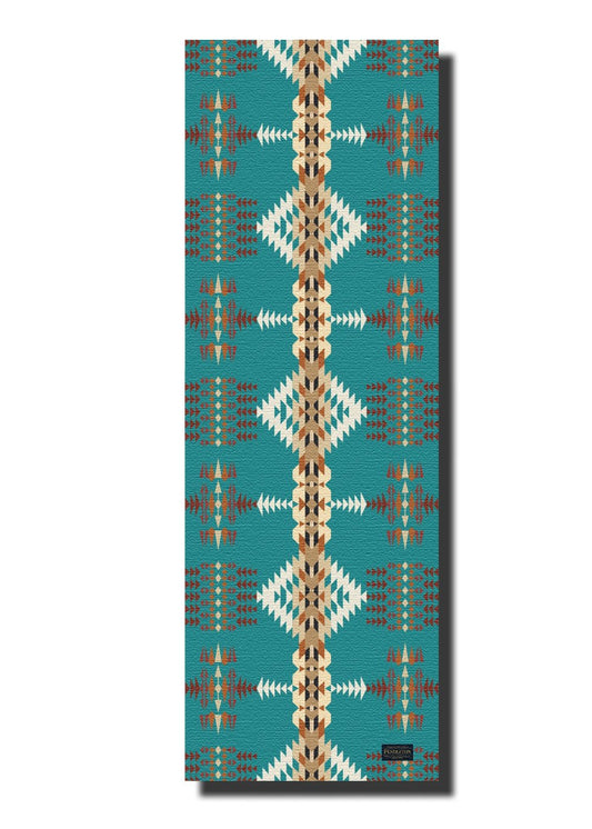 Yoga mat with geometric pattern on a teal background