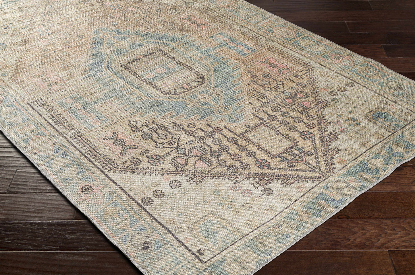 Patterned rug on a wooden floor