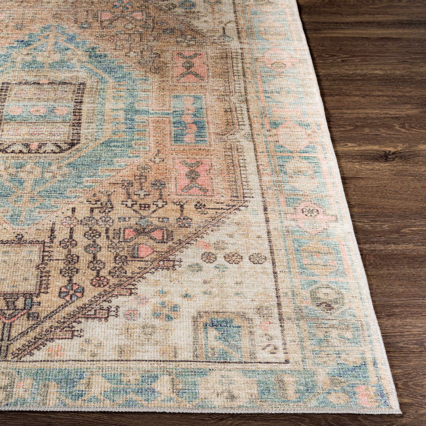 Close-up of a patterned rug on a wooden floor