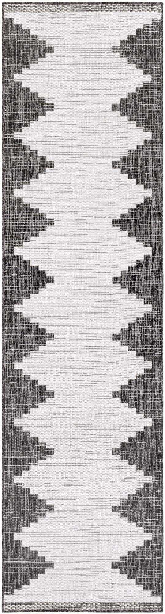 Woven runner rug with zigzag pattern in gray and white