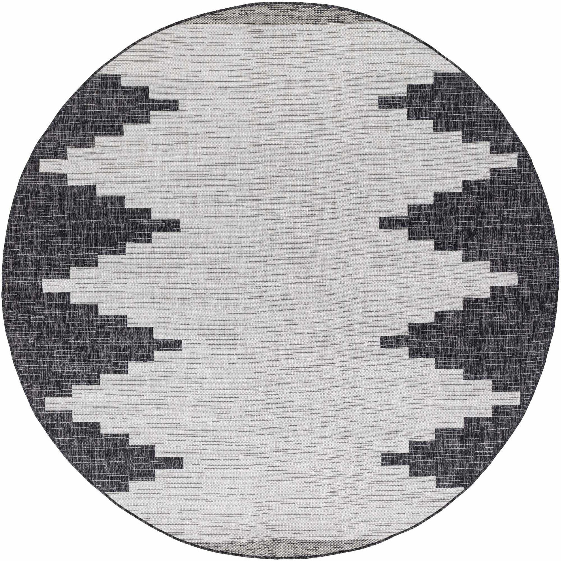 Round rug with a geometric pattern on a white background