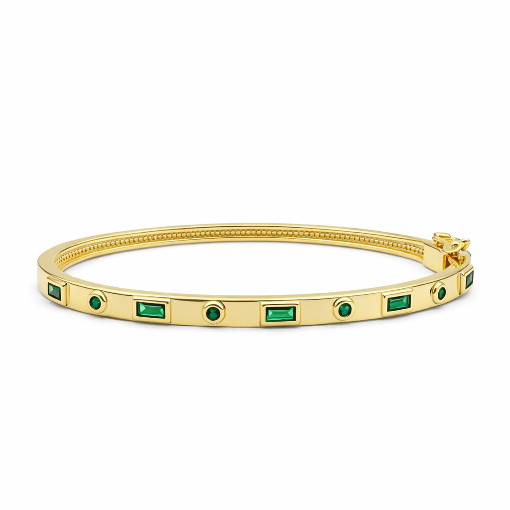 Goldfilled bangle with bezel-set emerald gemstones