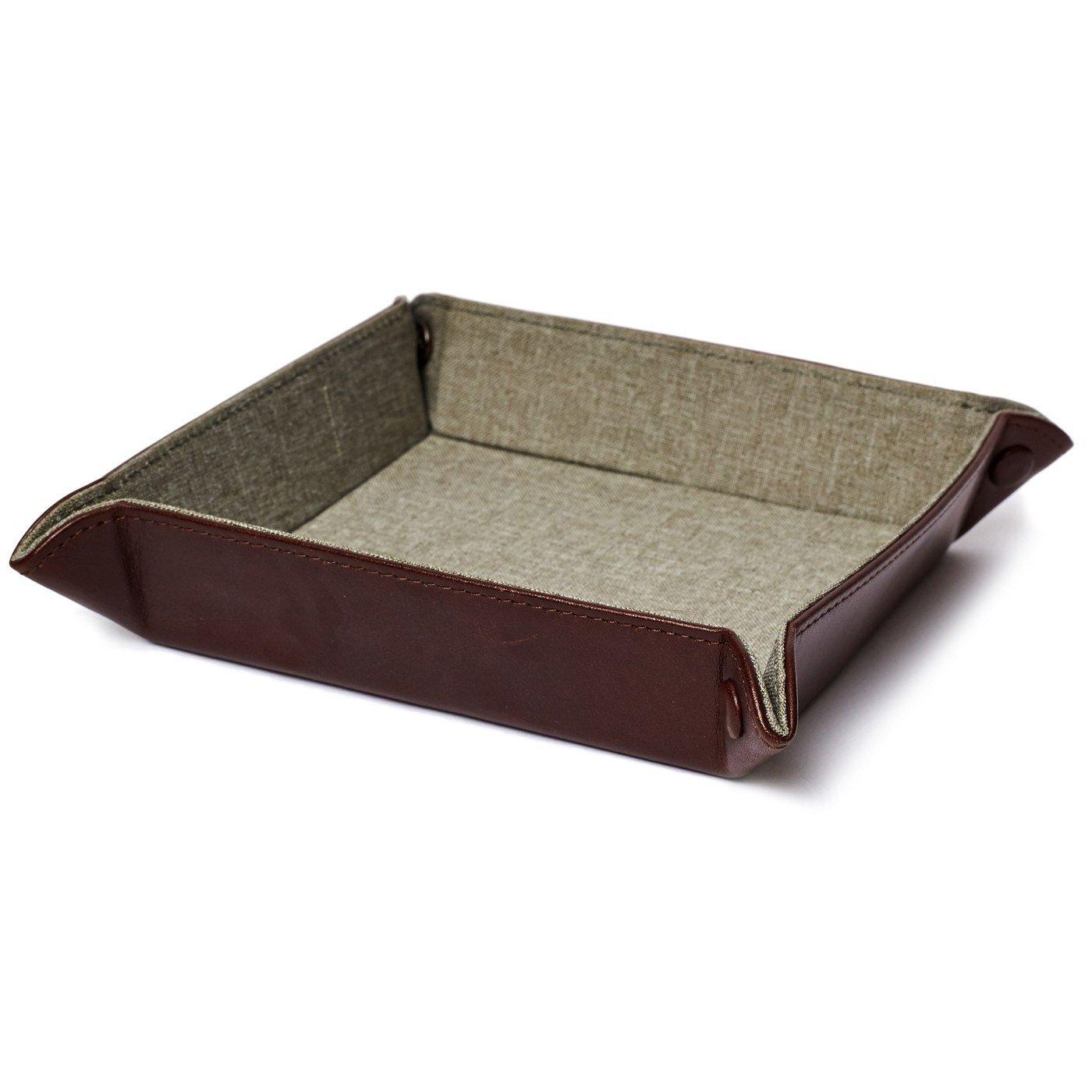 Brown leather valet tray with foldable snap design, lined interior, and PX embossing for stylish everyday organization.