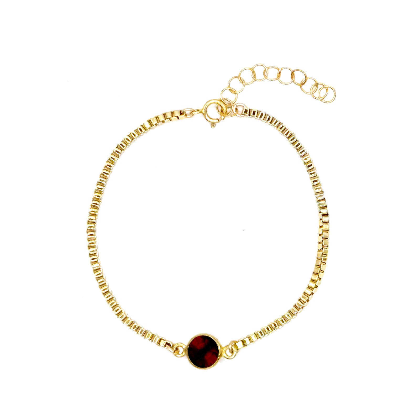 Flat view of garnet gemstone bracelet in goldfilled chain