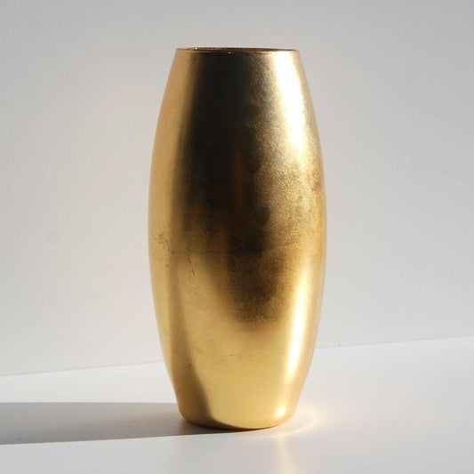 Handcrafted 10-inch gold gilded flower vase with a modern distressed finish, mouth-blown glass design, and elegant metallic leaf detailing.