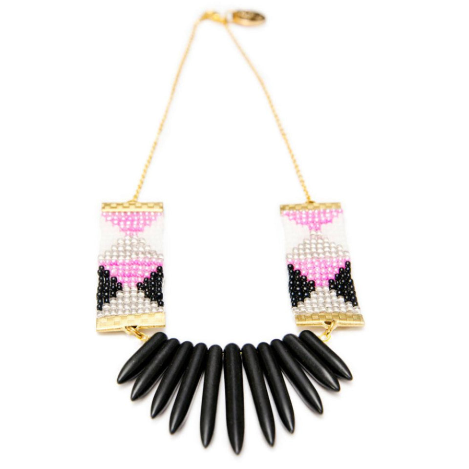 Handwoven beaded necklace in pink, black, and white, featuring bold black howlite stone spikes and a 24-carat gold-plated chain, designed by Shh by Sadie.