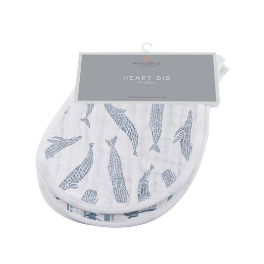 Ocean-themed bamboo burp cloth set featuring whales, sailboats, and palm trees, reversible design with snap closure for easy wear.