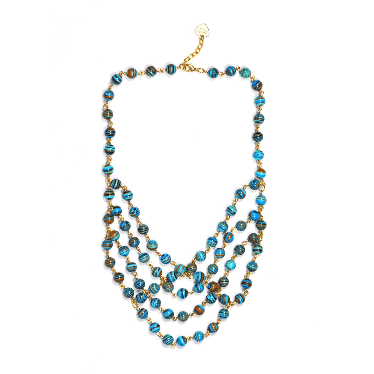Flat lay of layered stripe turquoise beaded necklace with gold chain